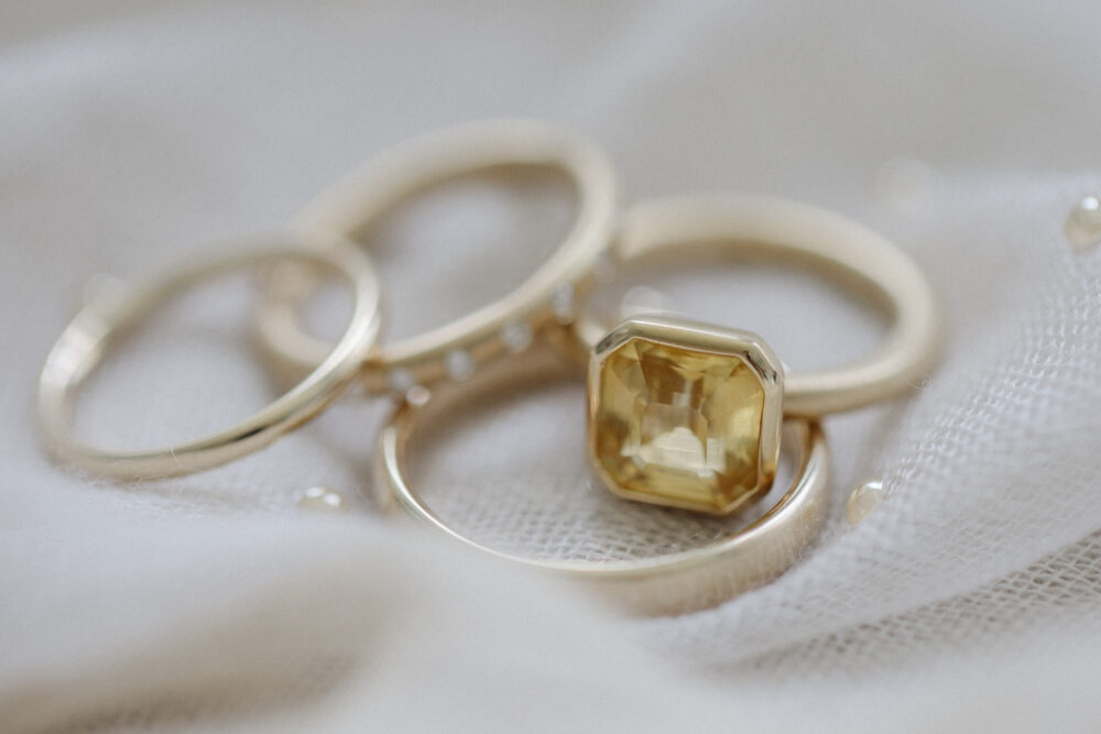 up close shot of bride and groom gold wedding bands