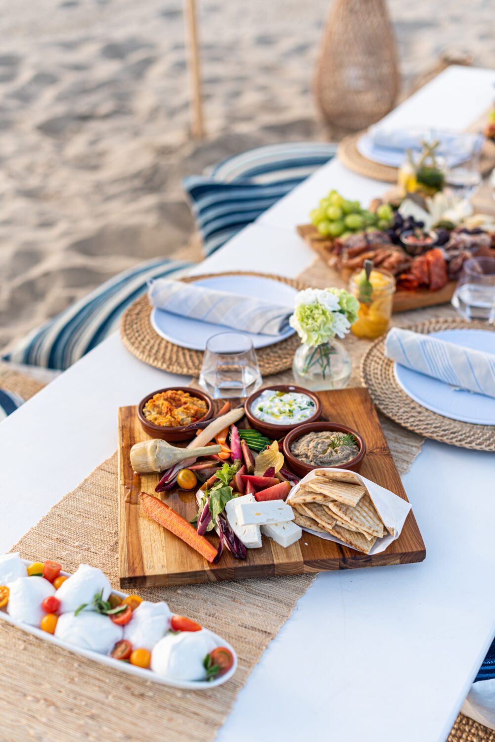 beach picnic tablespace with cheese and meat board