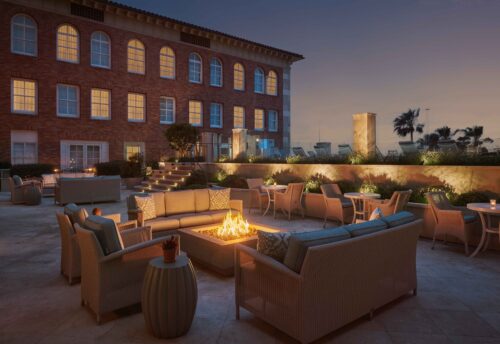 firepit with seating around, by the pool