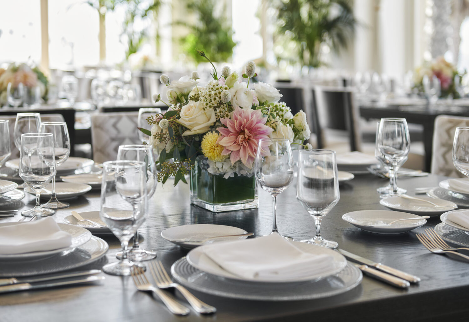table setting with flower arrangement in the center