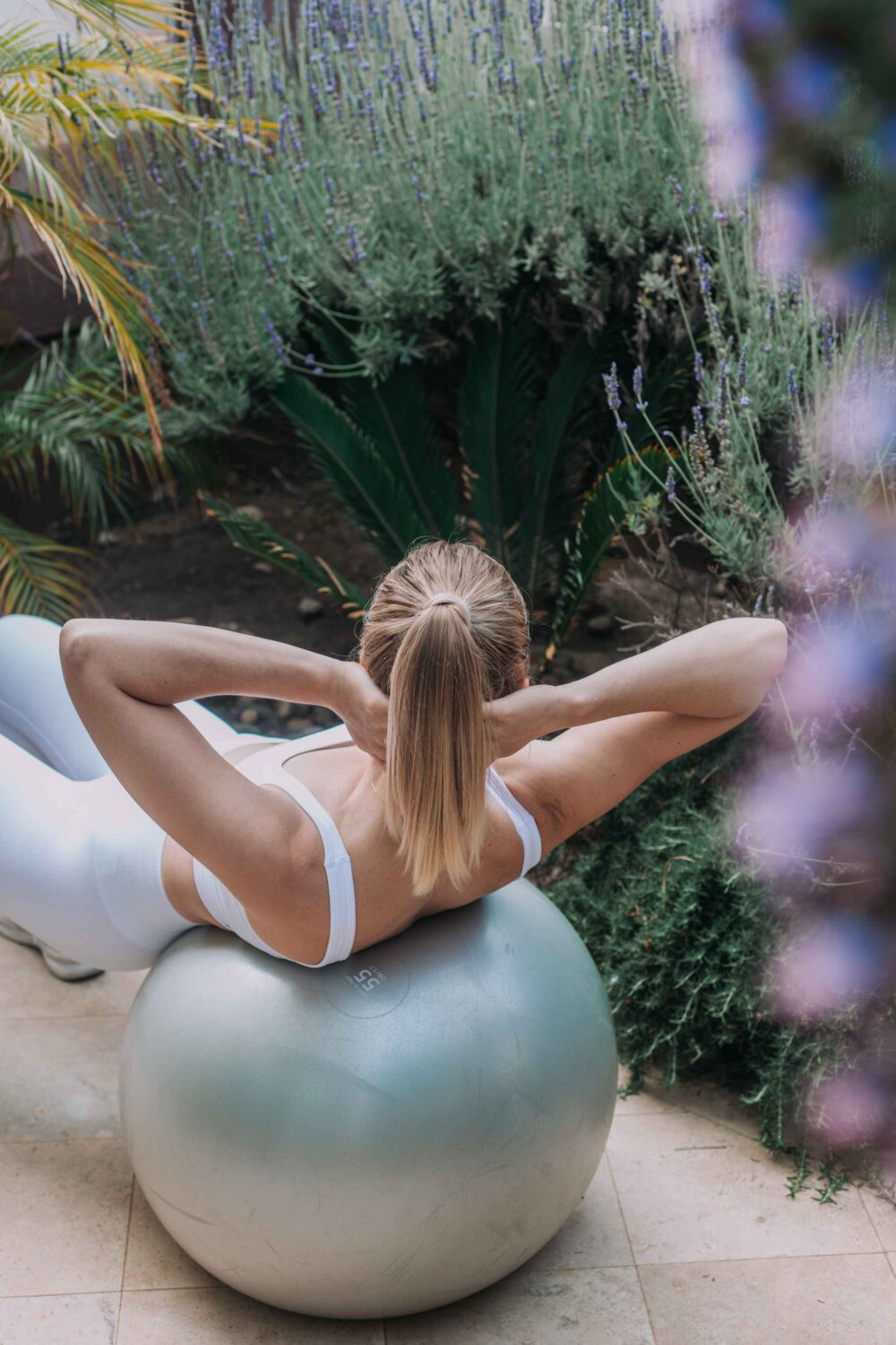 Woman doing crunches on exercise ball