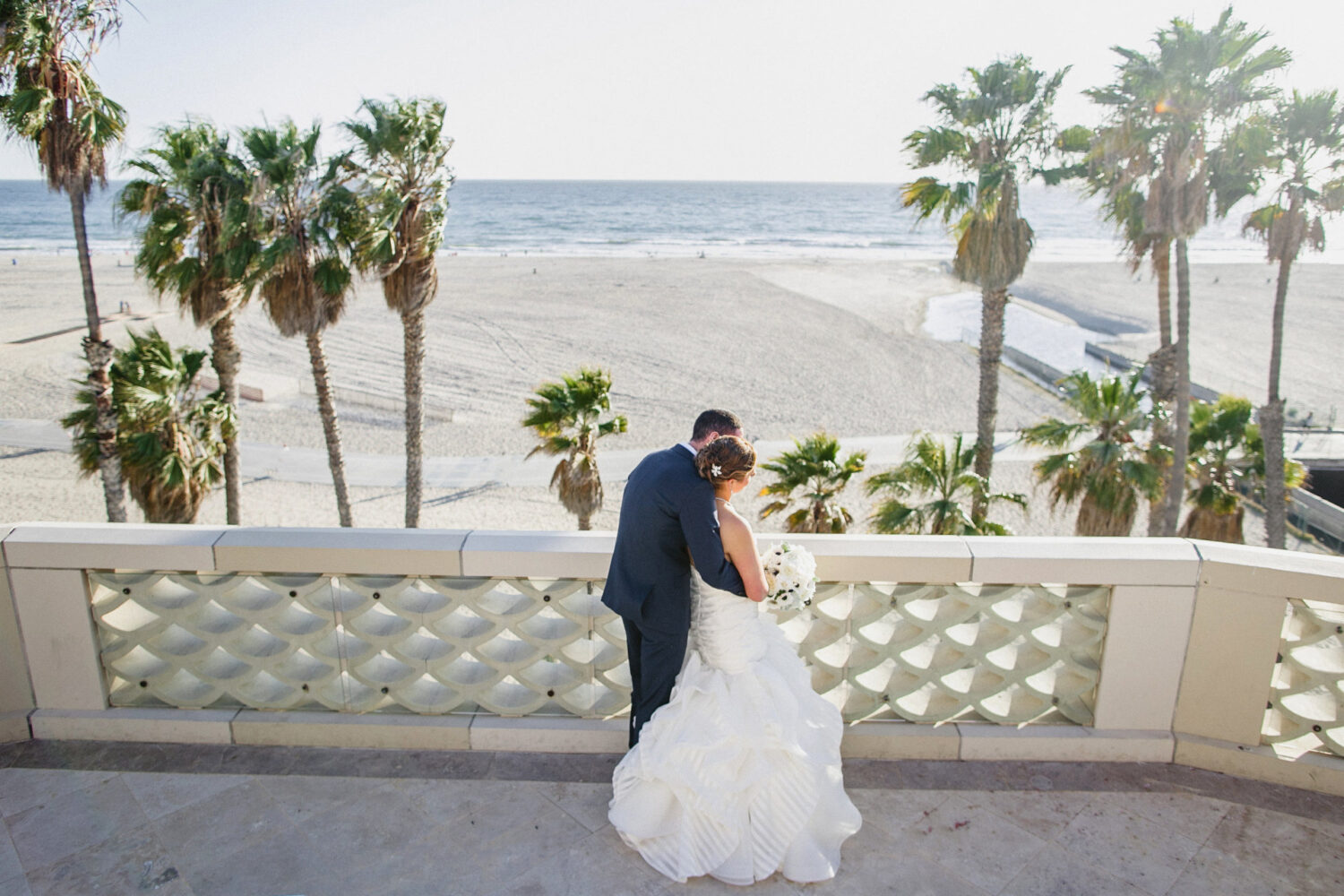 couple's wedding shot on the terrace over looking the ocean
