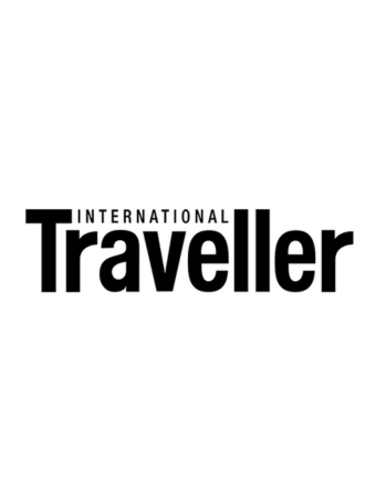 The International Traveller logo features black lettering on a white background.